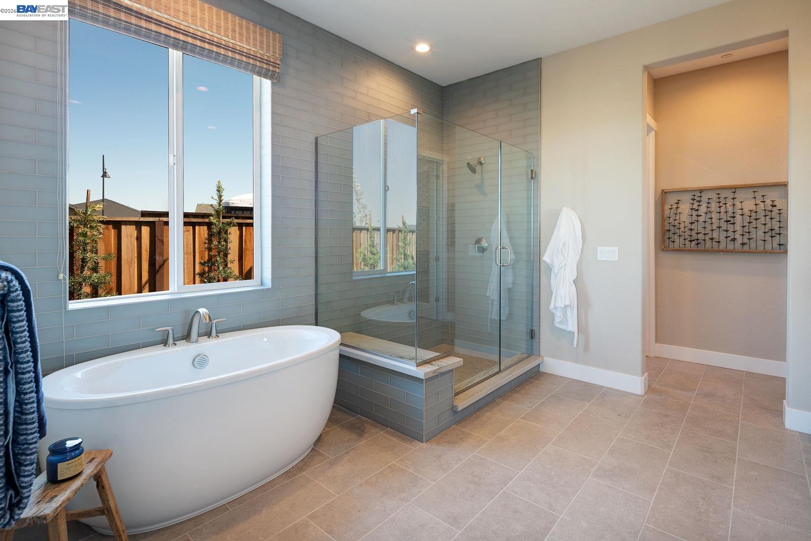 927 Conrad Street Manteca, CA 95336 - Photo 19 of 42 a bathroom with a bathtub and a shower