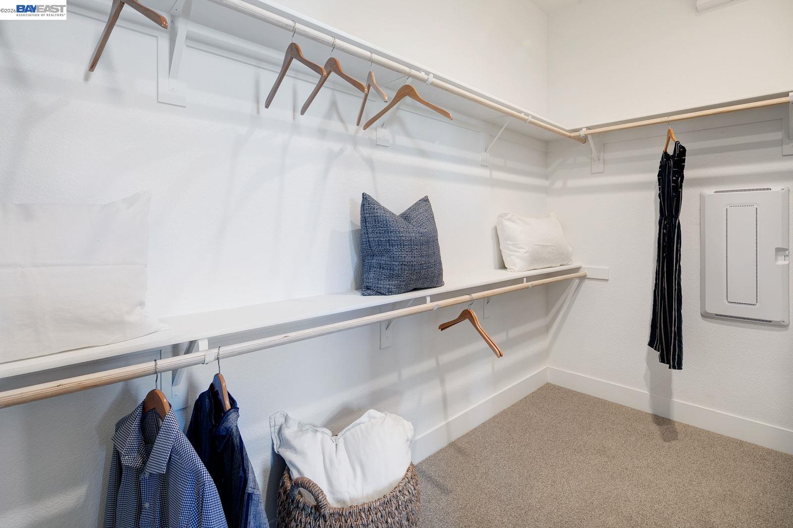 927 Conrad Street Manteca, CA 95336 - Photo 22 of 42 a view of walk in closet with clothes and shoes