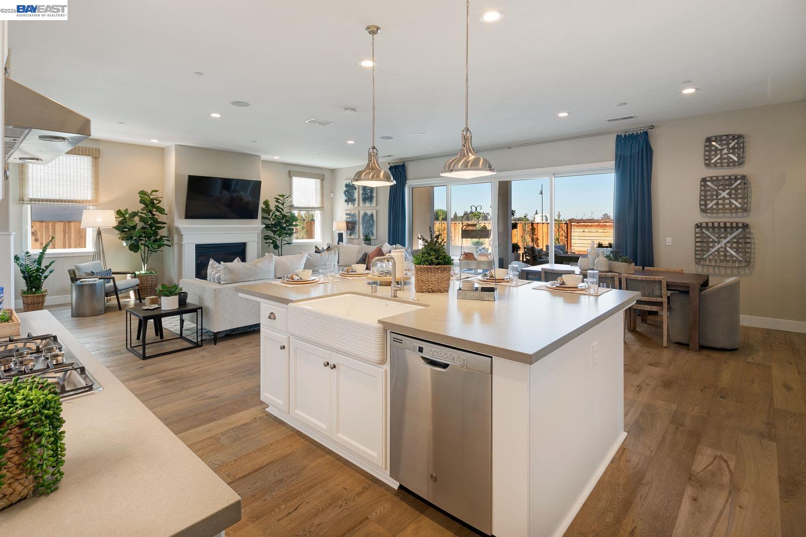927 Conrad Street Manteca, CA 95336 - Photo 23 of 42 a kitchen with stainless steel appliances kitchen island granite countertop a sink and a refrigerator