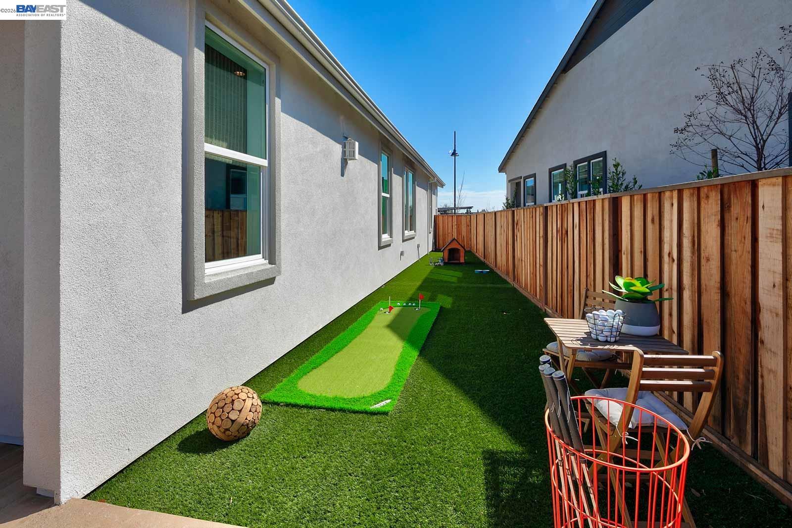 927 Conrad Street Manteca, CA 95336 - Photo 31 of 42 a view of a backyard with couches chair and a yard