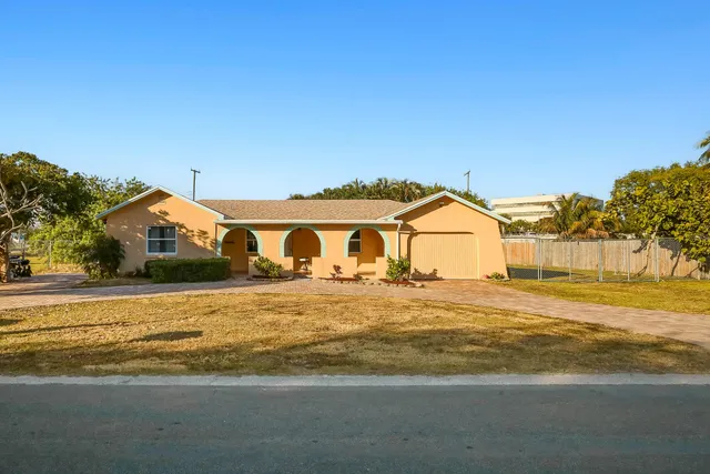 a front view of a house with a ocean view