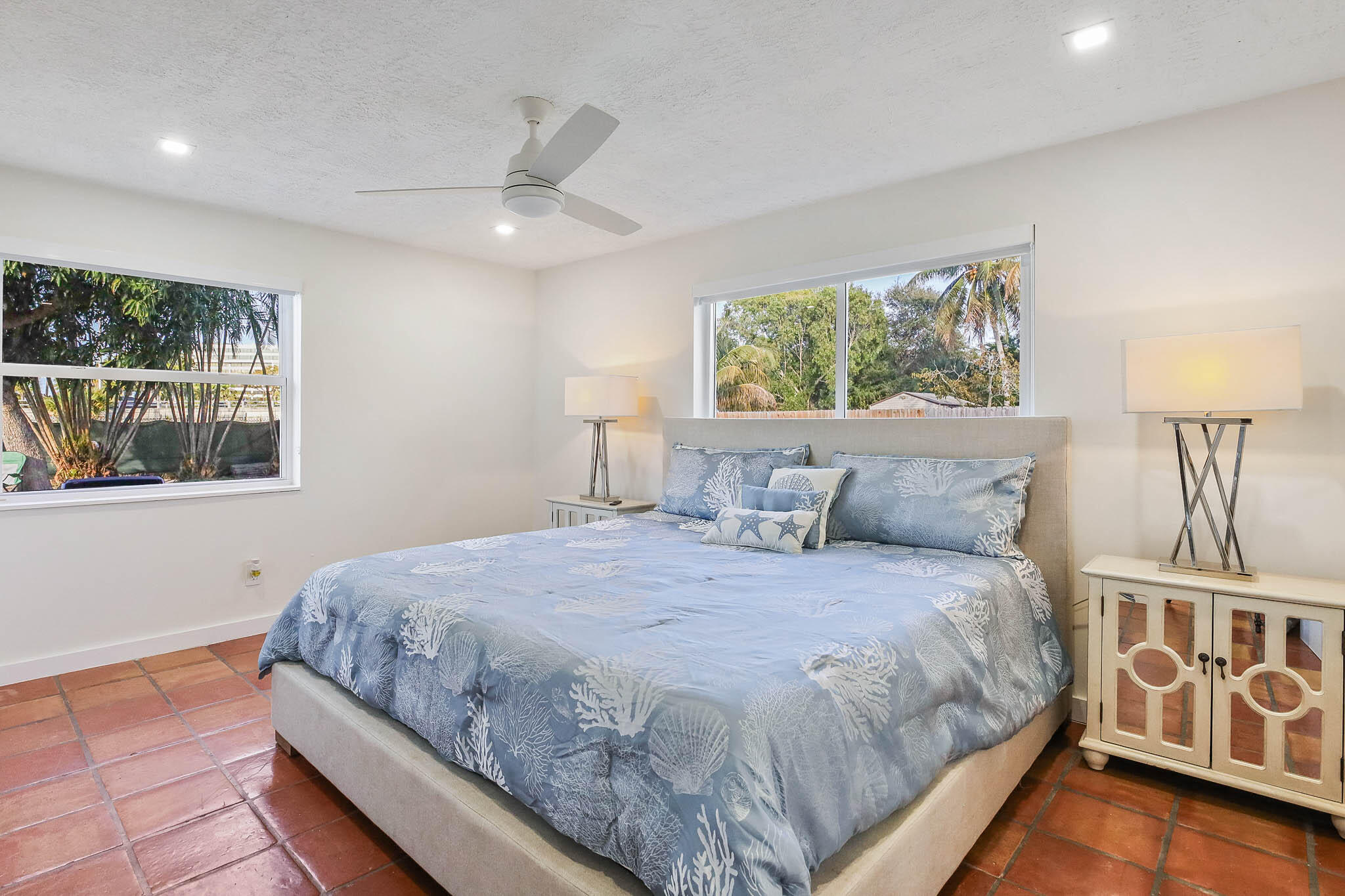 103 East Shannondale Road Cloud Lake, FL 33406 - Photo 14 of 31 a bedroom with a large bed and a window