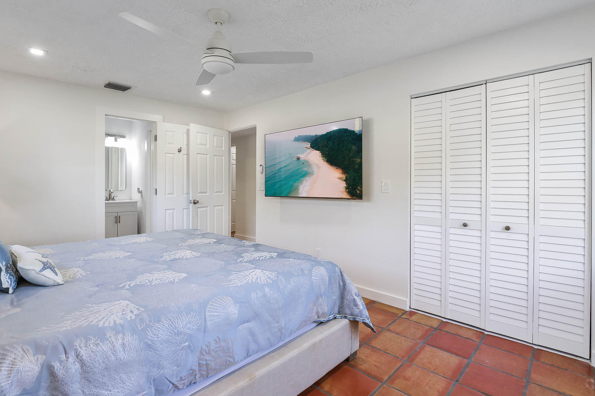 103 East Shannondale Road Cloud Lake, FL 33406 - Photo 16 of 31 a bedroom with a bed and a painting on the wall