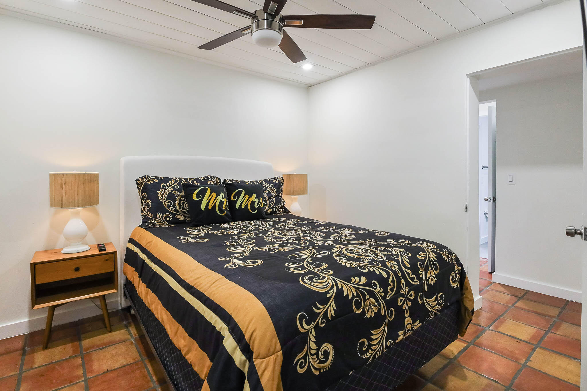 103 East Shannondale Road Cloud Lake, FL 33406 - Photo 19 of 31 a bedroom with a bed and a window