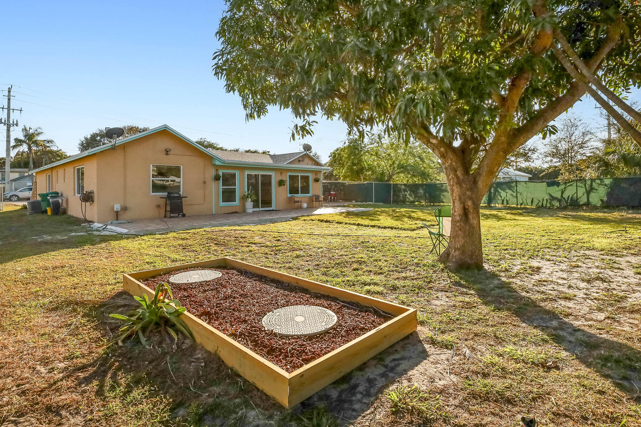 103 East Shannondale Road Cloud Lake, FL 33406 - Photo 27 of 31 a view of a house with pool and sitting area
