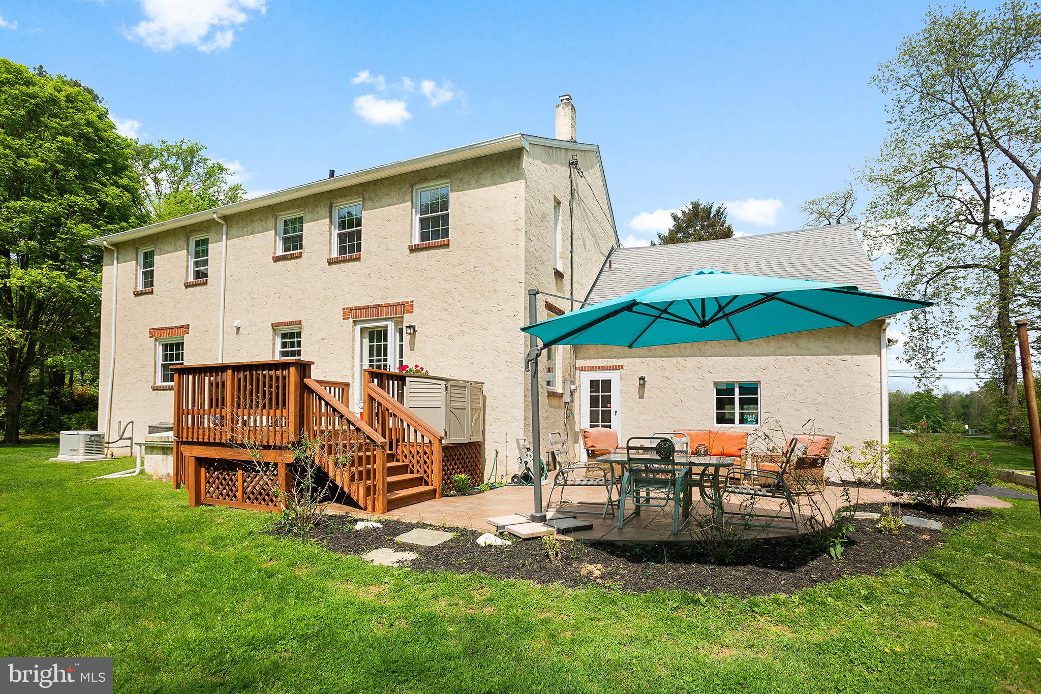 114 Grubb Road Malvern, PA 19355 - Photo 28 of 29 Rear deck and patio. raised vegetable beds to side