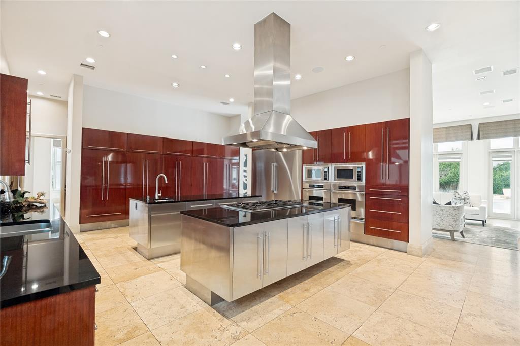 6432 Sudbury Road Plano, TX 75024 - Photo 16 of 38 a kitchen with stainless steel appliances granite countertop a stove and a sink