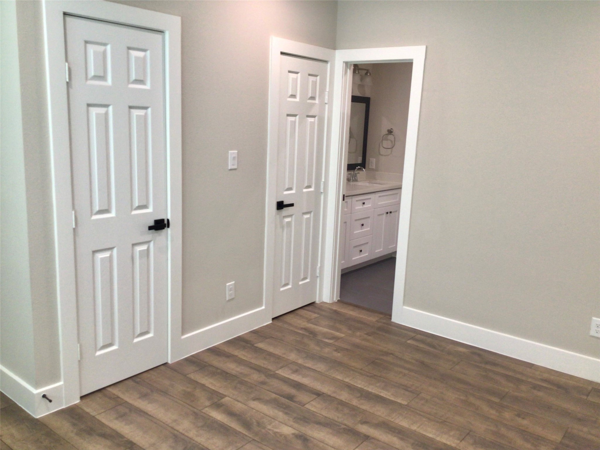 2109 Marnel Road, Unit D Houston, TX 77055 - Photo 11 of 26 an empty room with wooden floor and closet area