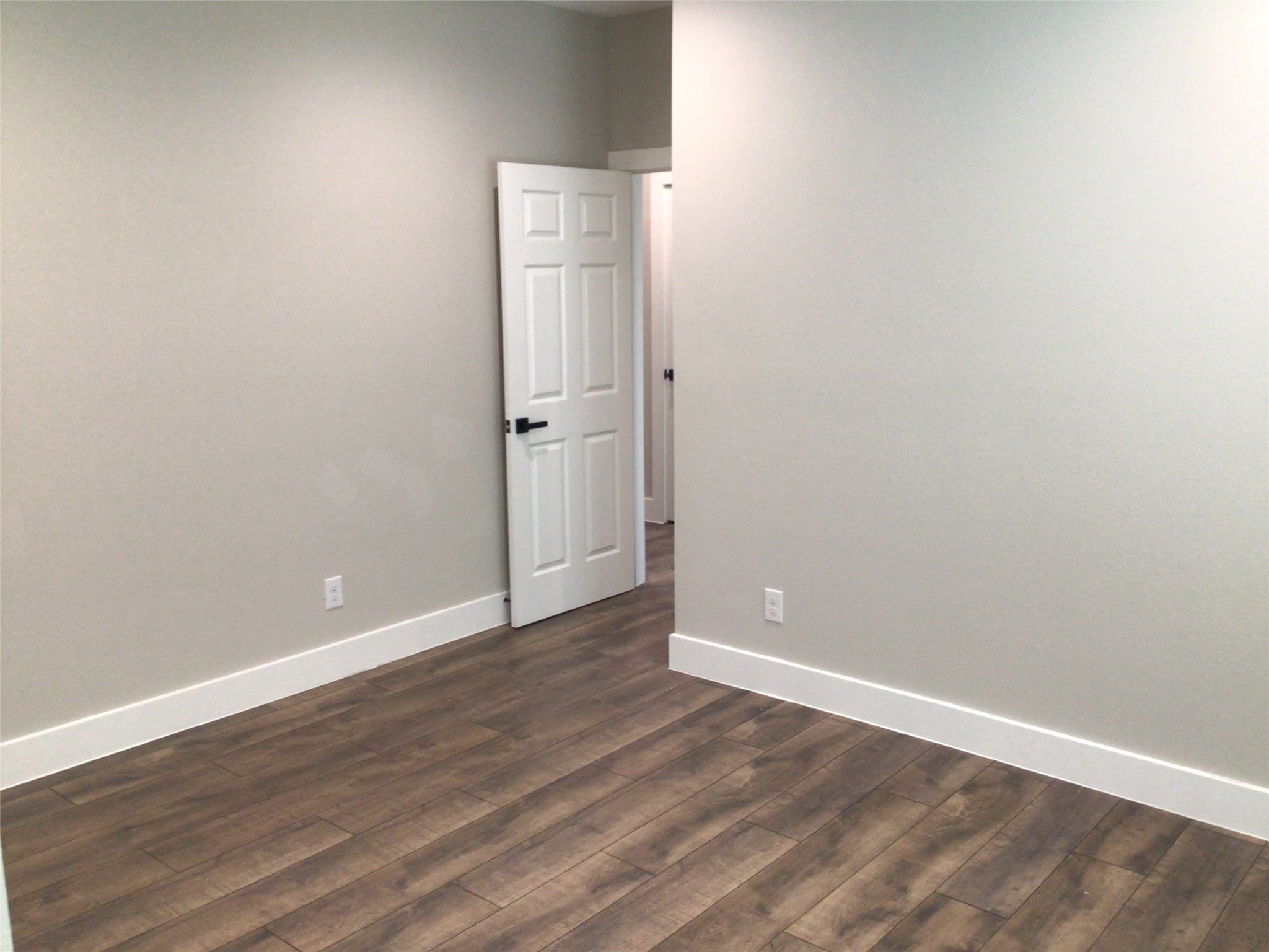 2109 Marnel Road, Unit D Houston, TX 77055 - Photo 12 of 26 a view of an empty room with wooden floor
