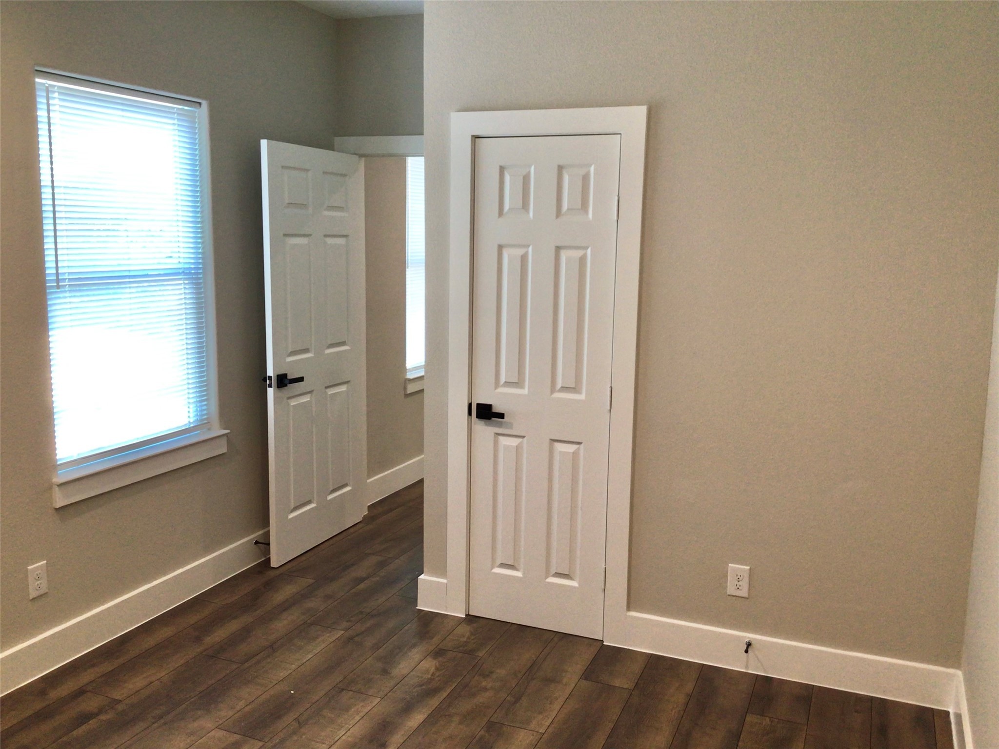 2109 Marnel Road, Unit D Houston, TX 77055 - Photo 18 of 26 an empty room with wooden floor and a window