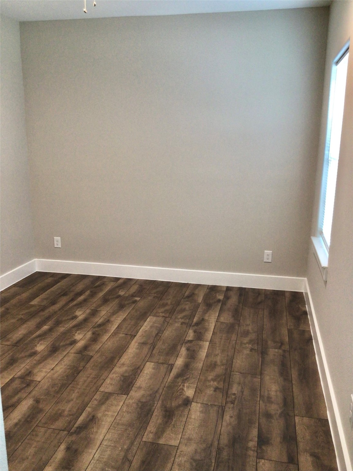 2109 Marnel Road, Unit D Houston, TX 77055 - Photo 19 of 26 a view of a room with wooden floor and window