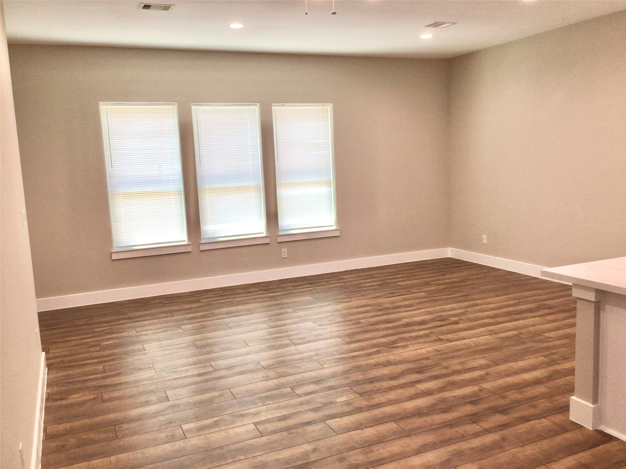 2109 Marnel Road, Unit D Houston, TX 77055 - Photo 7 of 26 wooden floor in an empty room with a window