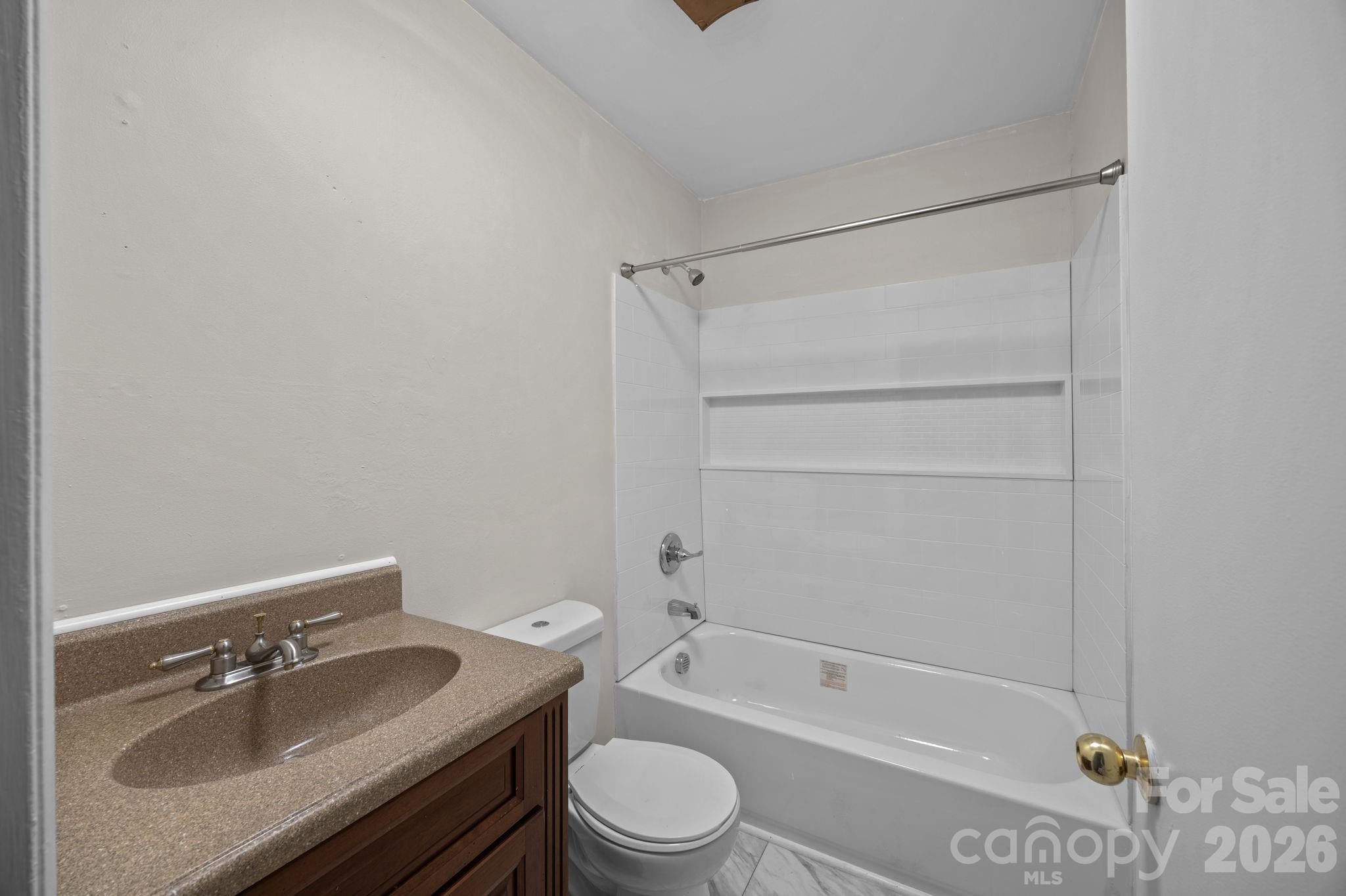 1158 Sunset Court Conover, NC 28613 - Photo 16 of 31 a bathroom with a sink toilet vanity and tub