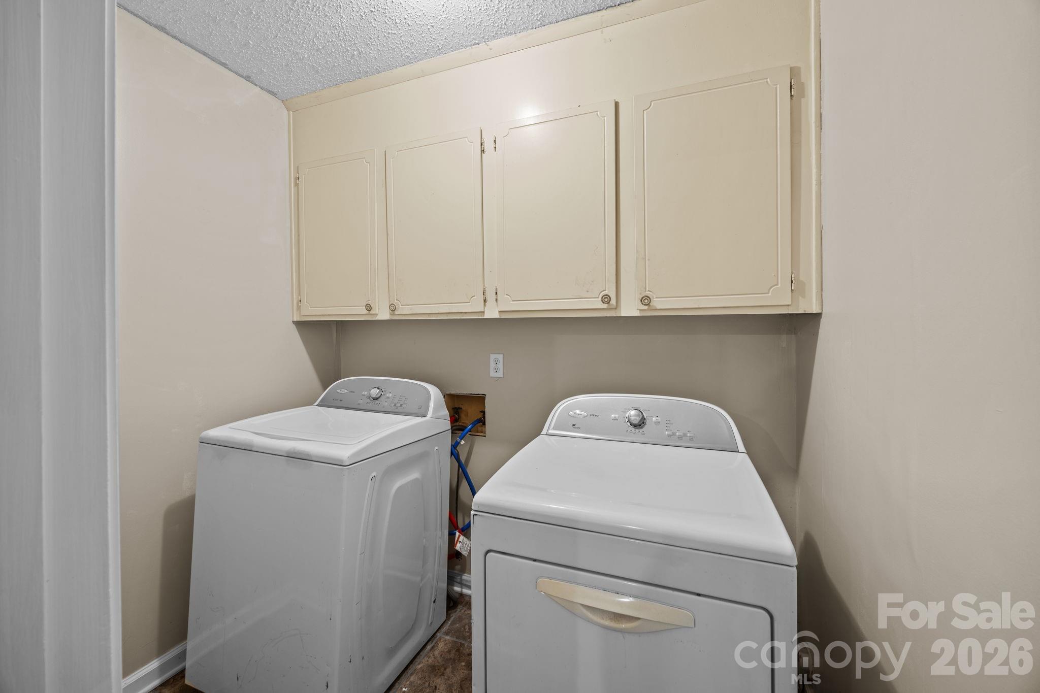 1158 Sunset Court Conover, NC 28613 - Photo 18 of 31 a view of storage and utility room with washer and dryer