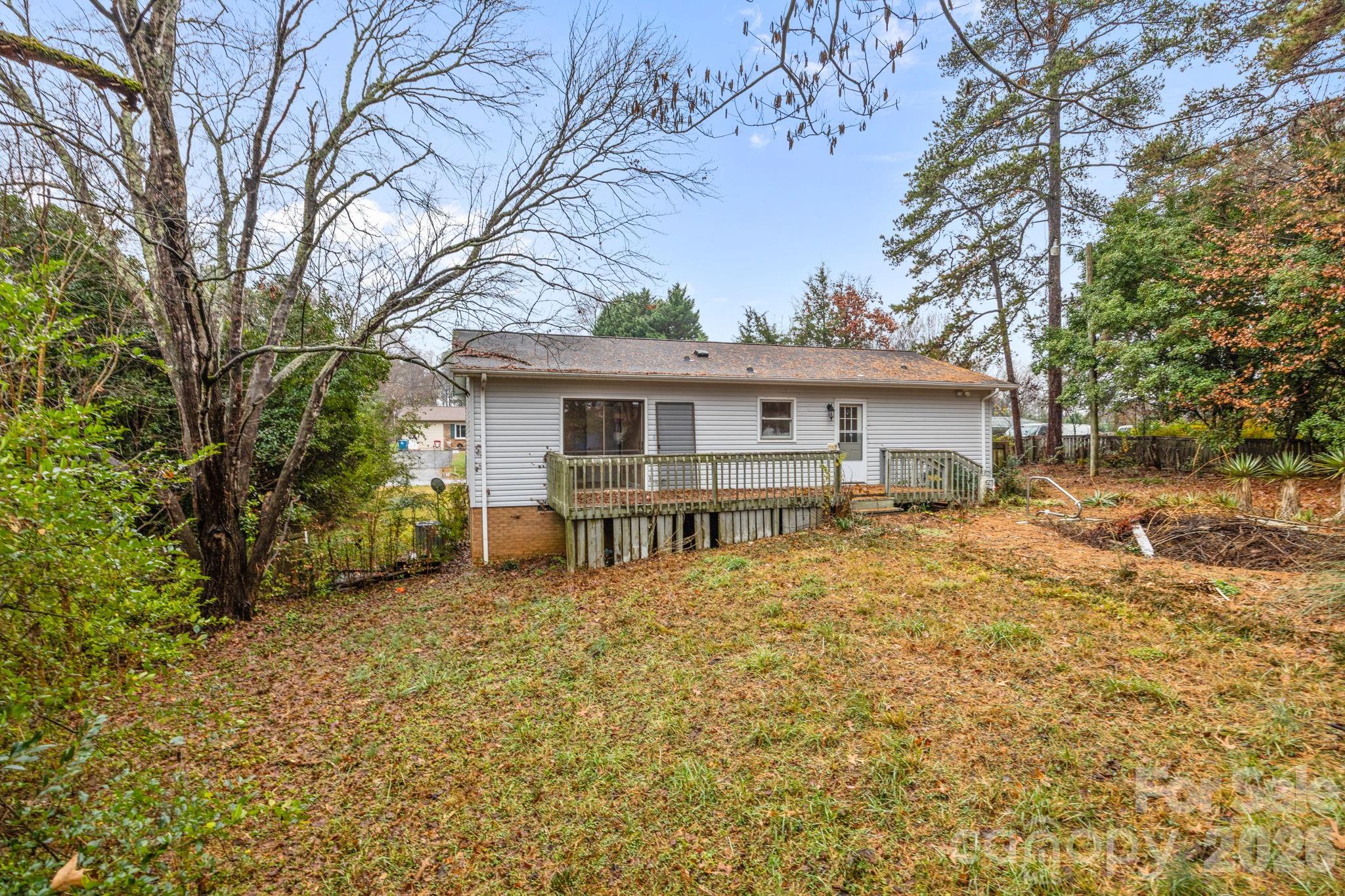 1158 Sunset Court Conover, NC 28613 - Photo 23 of 31 a view of a house with a large tree and a yard