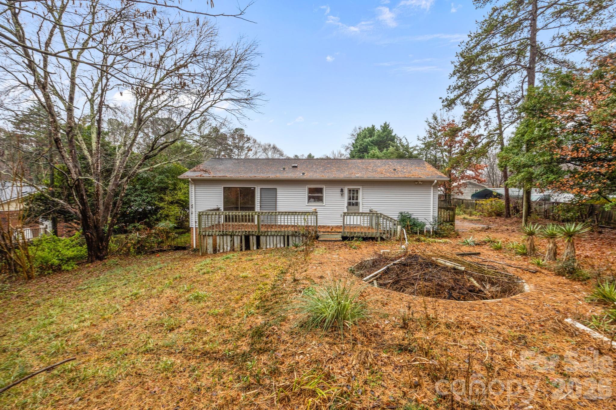 1158 Sunset Court Conover, NC 28613 - Photo 25 of 31 a view of a house with a yard covered with snow in the patio
