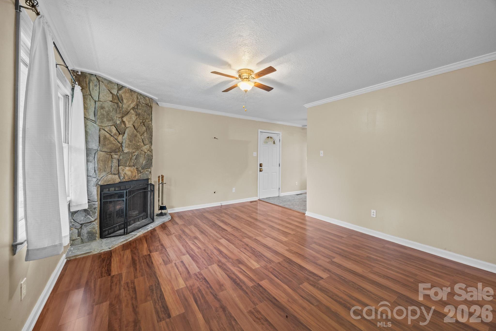1158 Sunset Court Conover, NC 28613 - Photo 5 of 31 wooden floor in an empty room with a window