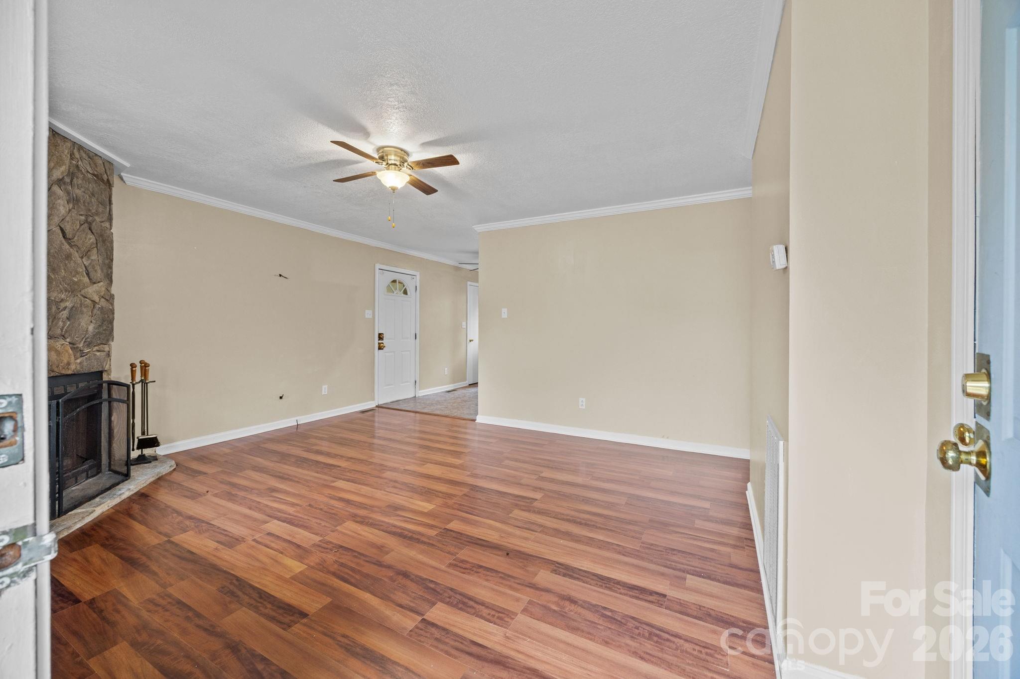 1158 Sunset Court Conover, NC 28613 - Photo 8 of 31 a view of empty room with wooden floor and fan