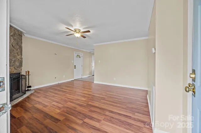 a living room with a fireplace and a window