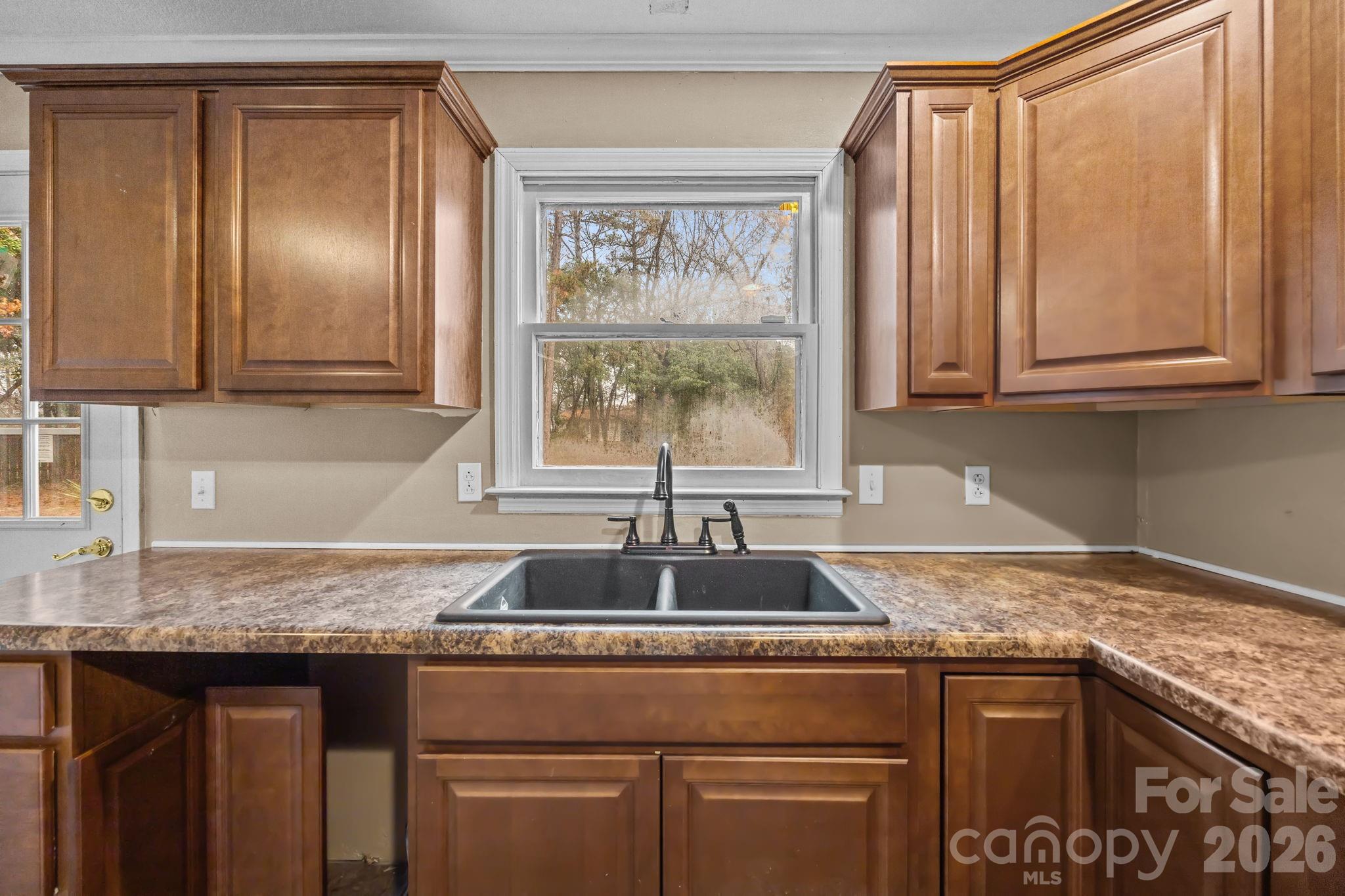 1158 Sunset Court Conover, NC 28613 - Photo 10 of 31 a kitchen with granite countertop a sink and a window
