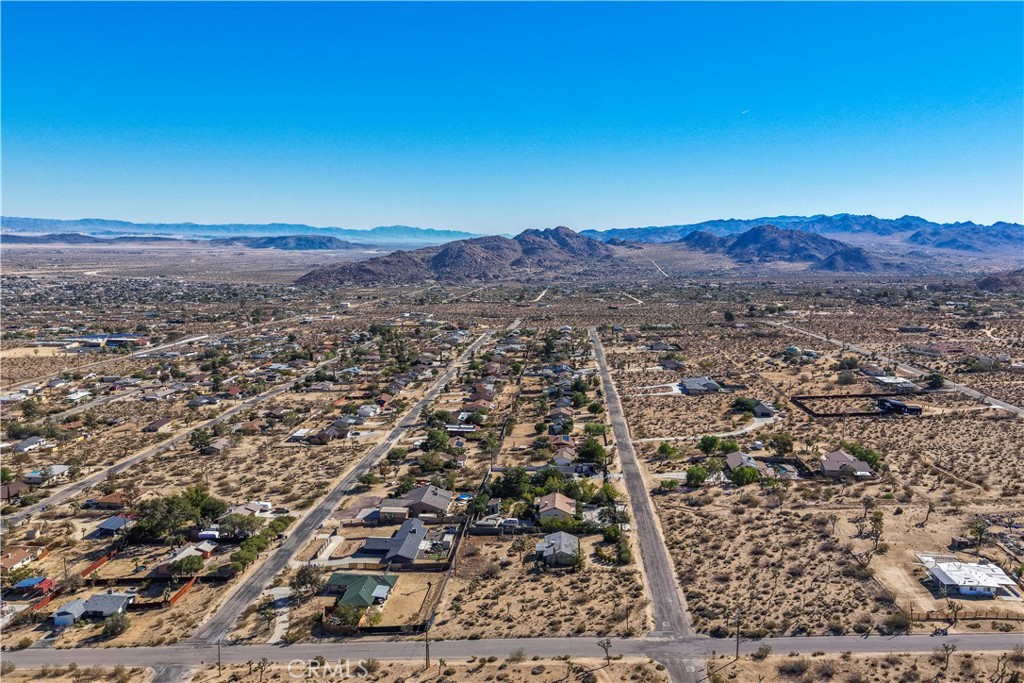 7505 Sherwood Road Joshua Tree, CA 92252 - Photo 4 of 12 an aerial view of residential house and green space