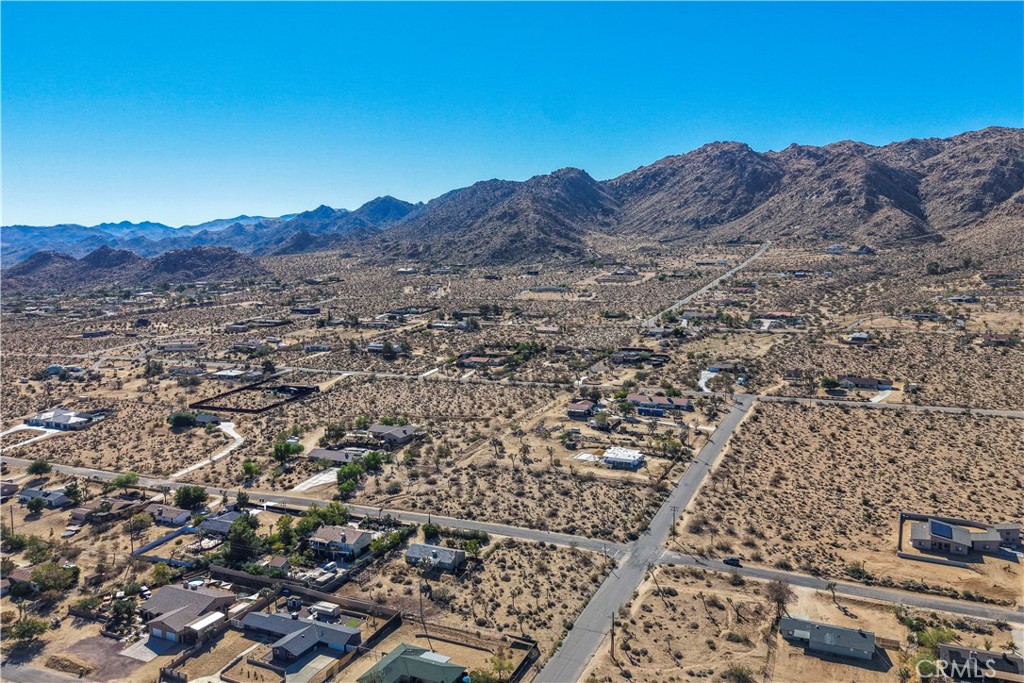 7505 Sherwood Road Joshua Tree, CA 92252 - Photo 5 of 12 an aerial view of residential house and sandy dunes