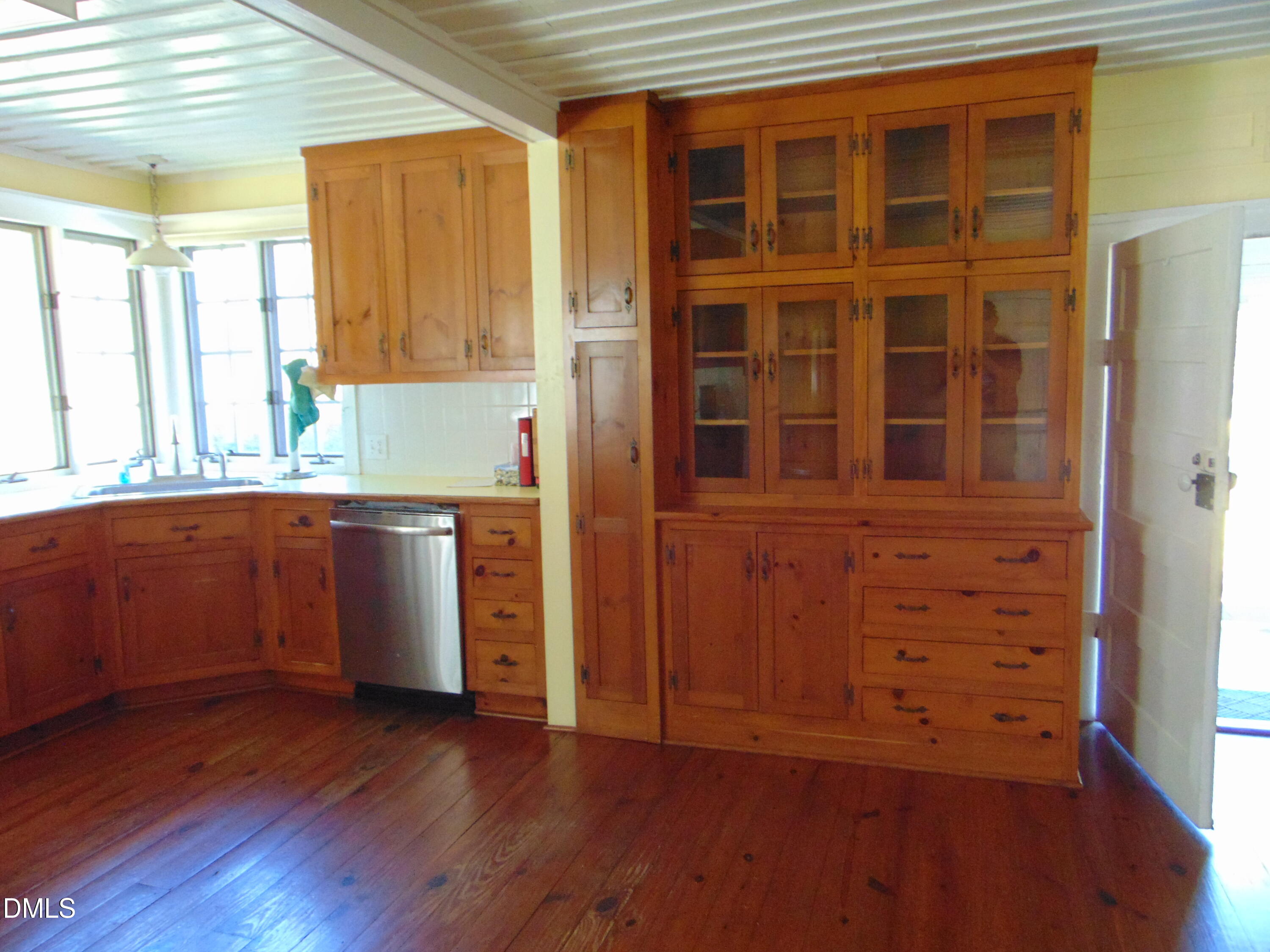 4067 Chewning Road Oxford, NC 27565 - Photo 79 of 82 a view of a kitchen with wooden floor and cabinets