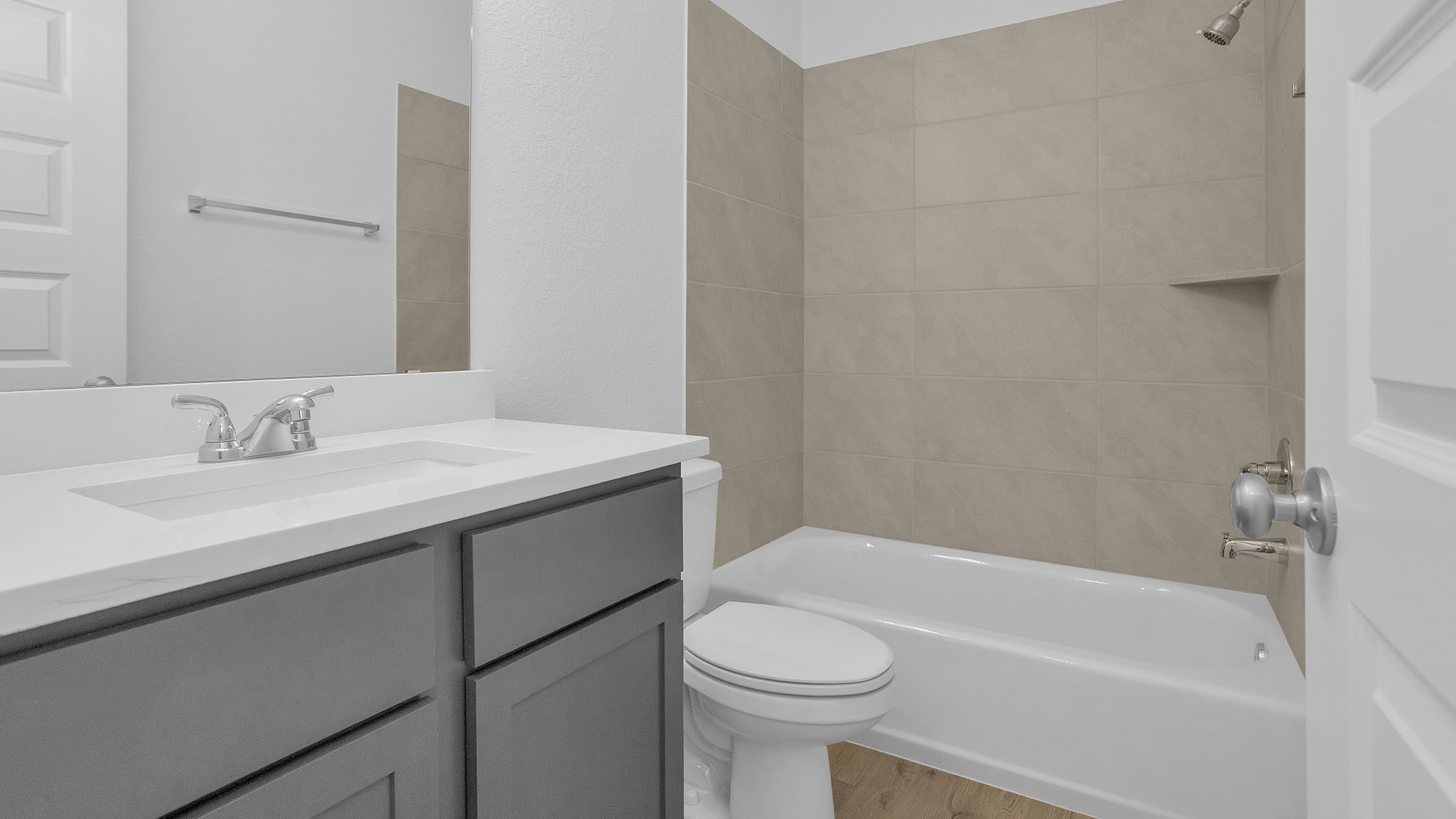 18222 Upper Brook Street Conroe, TX 77302 - Photo 11 of 26 a bathroom with a sink toilet vanity and bathtub