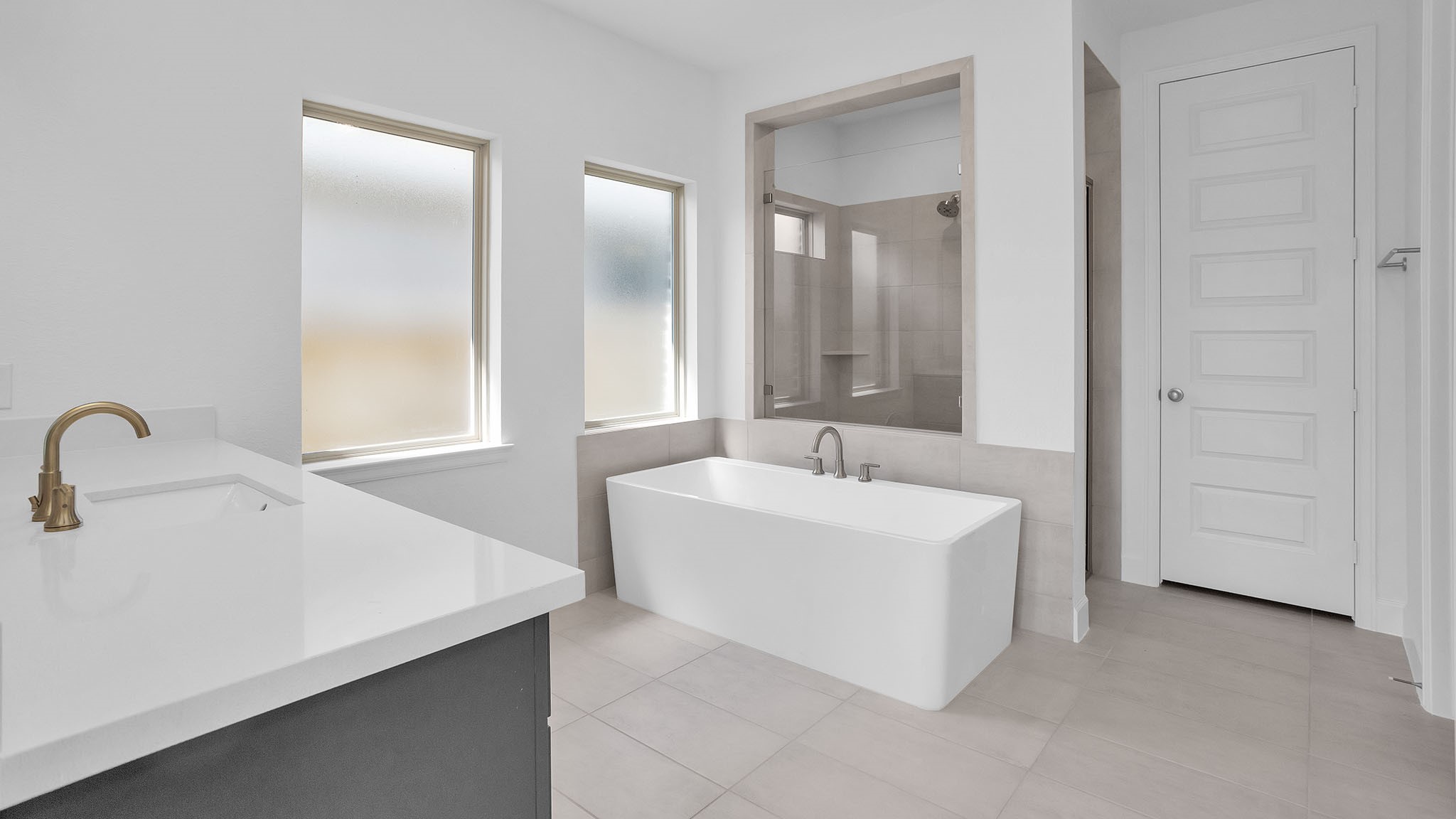 18222 Upper Brook Street Conroe, TX 77302 - Photo 14 of 26 a bathroom with a sink and a mirror