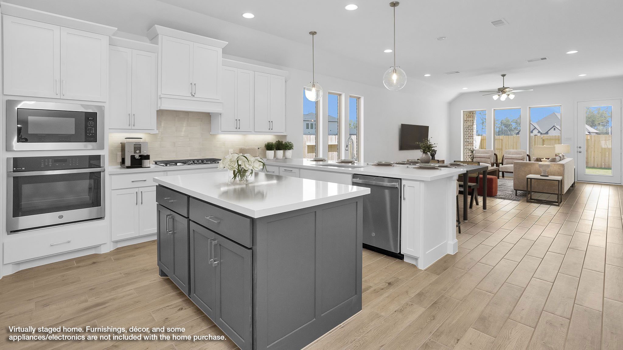 18222 Upper Brook Street Conroe, TX 77302 - Photo 2 of 26 a kitchen with a sink stove cabinets and wooden floor