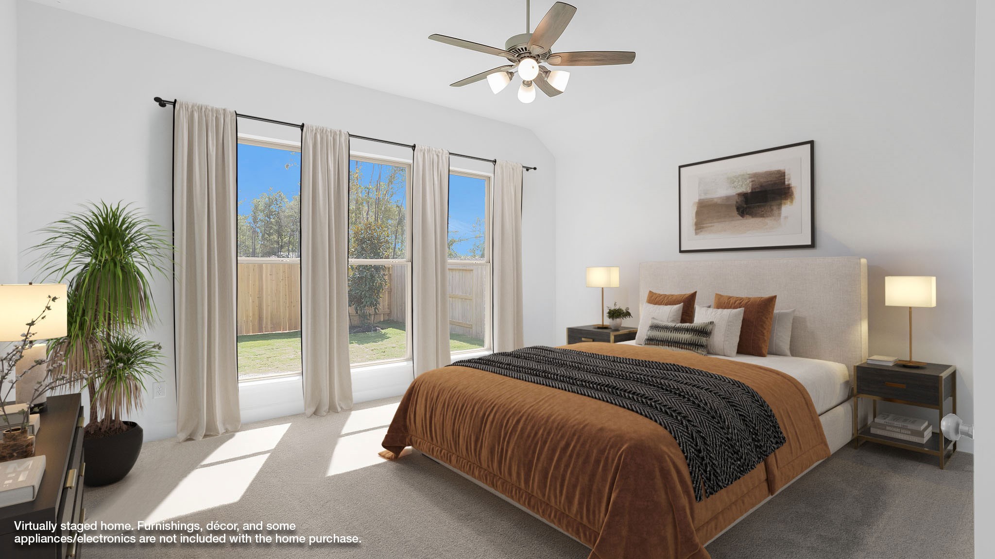 18222 Upper Brook Street Conroe, TX 77302 - Photo 3 of 26 a bedroom with a large bed and a chandelier