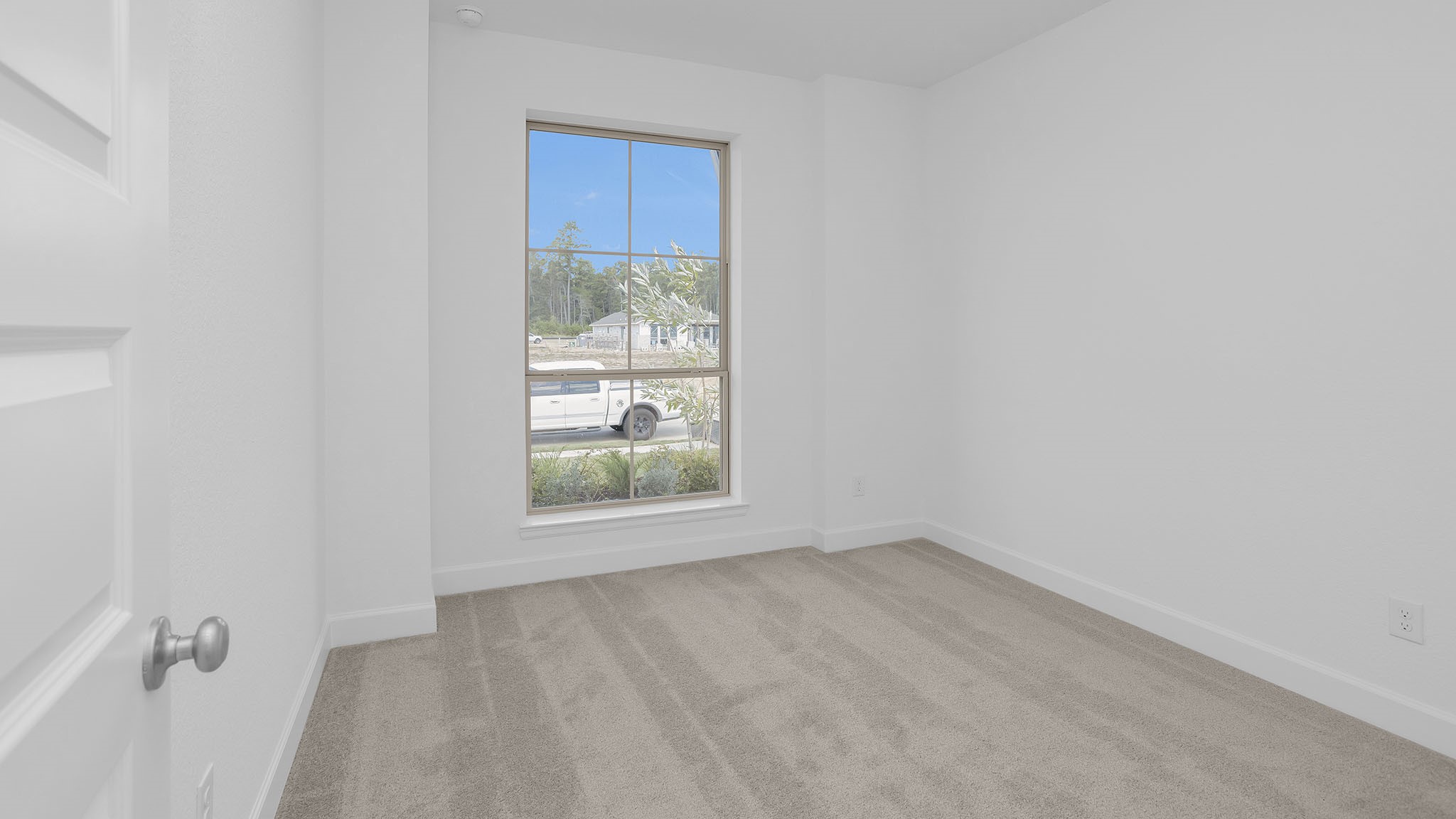 18222 Upper Brook Street Conroe, TX 77302 - Photo 8 of 26 a view of an empty room with a window