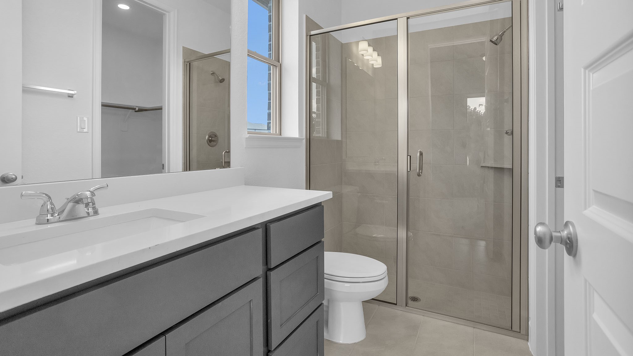 18222 Upper Brook Street Conroe, TX 77302 - Photo 9 of 26 a bathroom with a granite countertop sink toilet and shower
