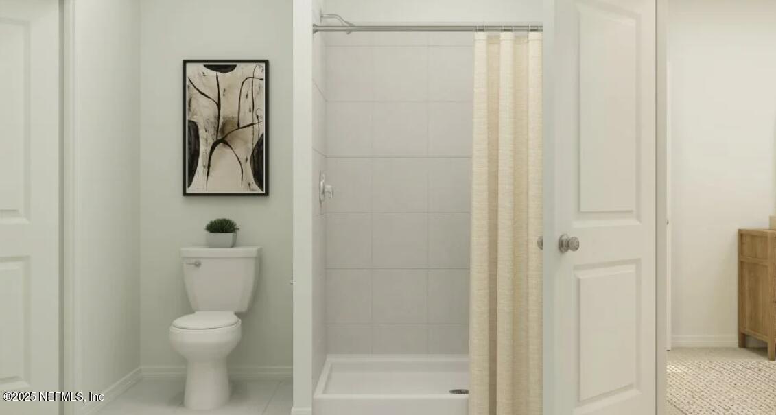 41 Powder Horn Drive Palm Coast, FL 32164 - Photo 5 of 15 a white toilet sitting next to a bathroom sink
