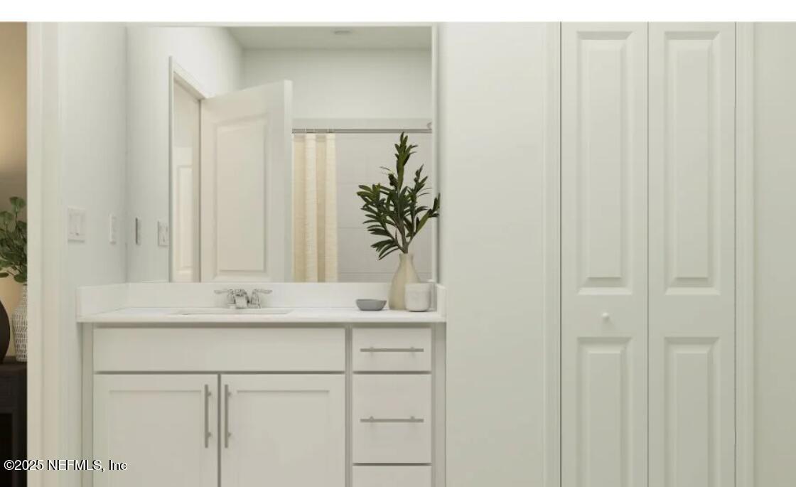 41 Powder Horn Drive Palm Coast, FL 32164 - Photo 6 of 15 a bathroom with a sink a vanity and a mirror