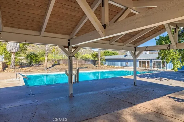 a view of a house with a wooden fence