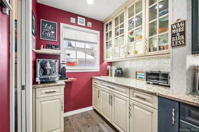 a kitchen with stainless steel appliances granite countertop a stove and a sink