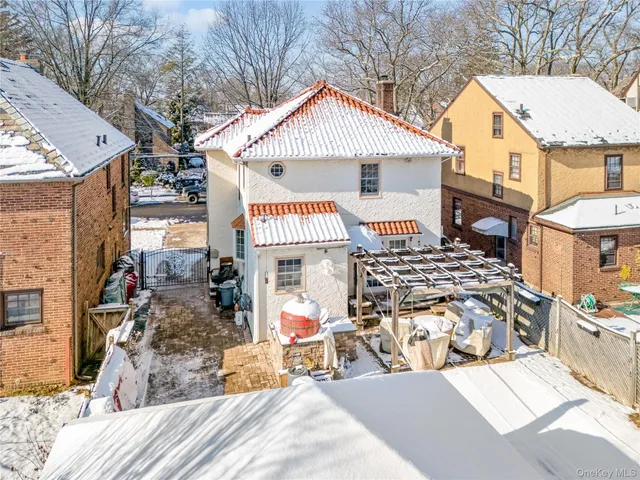 a view of a house with backyard space and balcony
