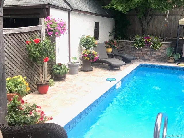 a view of yard with an outdoor seating