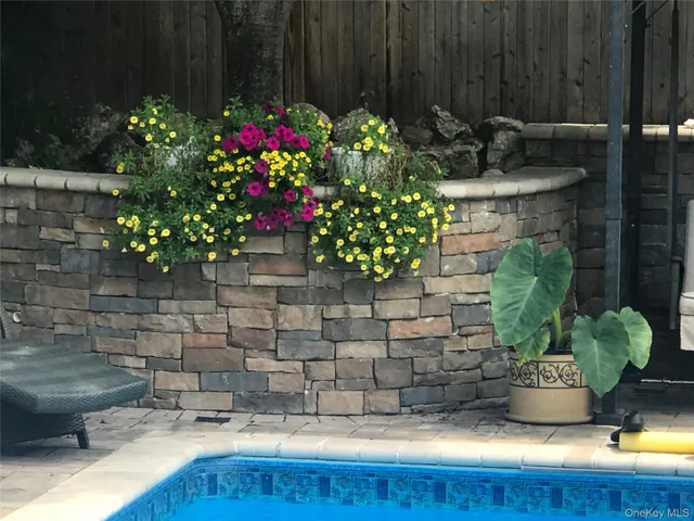 a front view of a house with a yard and seating space