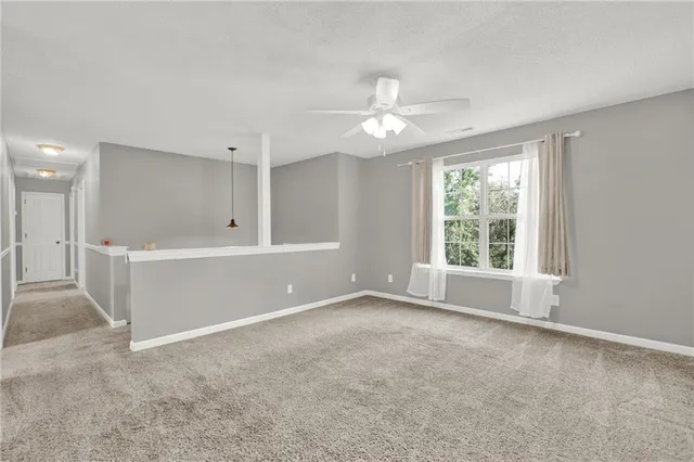 a view of a kitchen with wooden floor