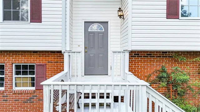 a view of a balcony with a potted plant
