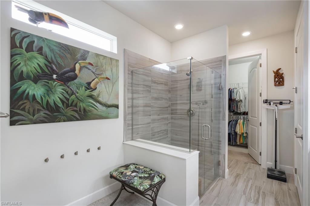 43007 Parkside Court Punta Gorda, FL 33982 - Photo 18 of 44 a bathroom with a bathtub and a shower