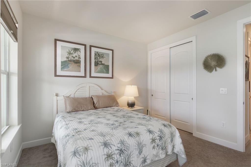 43007 Parkside Court Punta Gorda, FL 33982 - Photo 20 of 44 a bedroom with a bed and a window