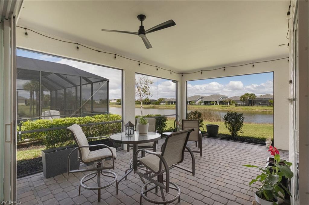 43007 Parkside Court Punta Gorda, FL 33982 - Photo 24 of 44 a dining room with furniture water view and a floor to ceiling window