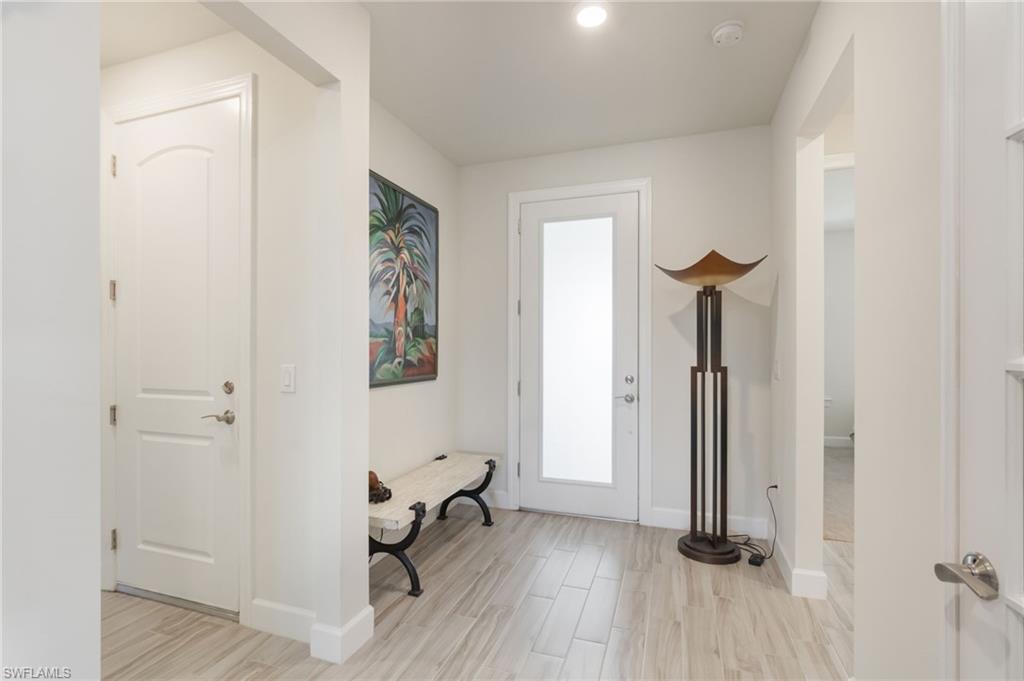 43007 Parkside Court Punta Gorda, FL 33982 - Photo 4 of 44 a view of a room with wooden floor and a sink