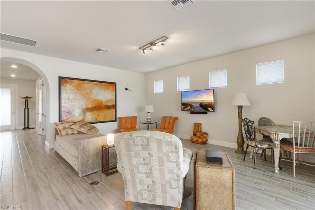 43007 Parkside Court Punta Gorda, FL 33982 - Photo 6 of 44 a living room with furniture and a flat screen tv