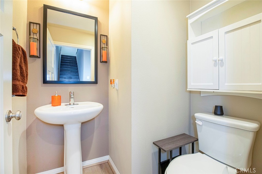 8656 Winnetka Avenue Winnetka, CA 91306 - Photo 12 of 31 a bathroom with a toilet sink and mirror