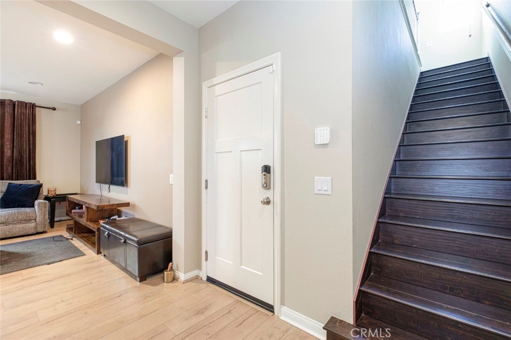 8656 Winnetka Avenue Winnetka, CA 91306 - Photo 13 of 31 a view of a hallway with workspace and wooden floor