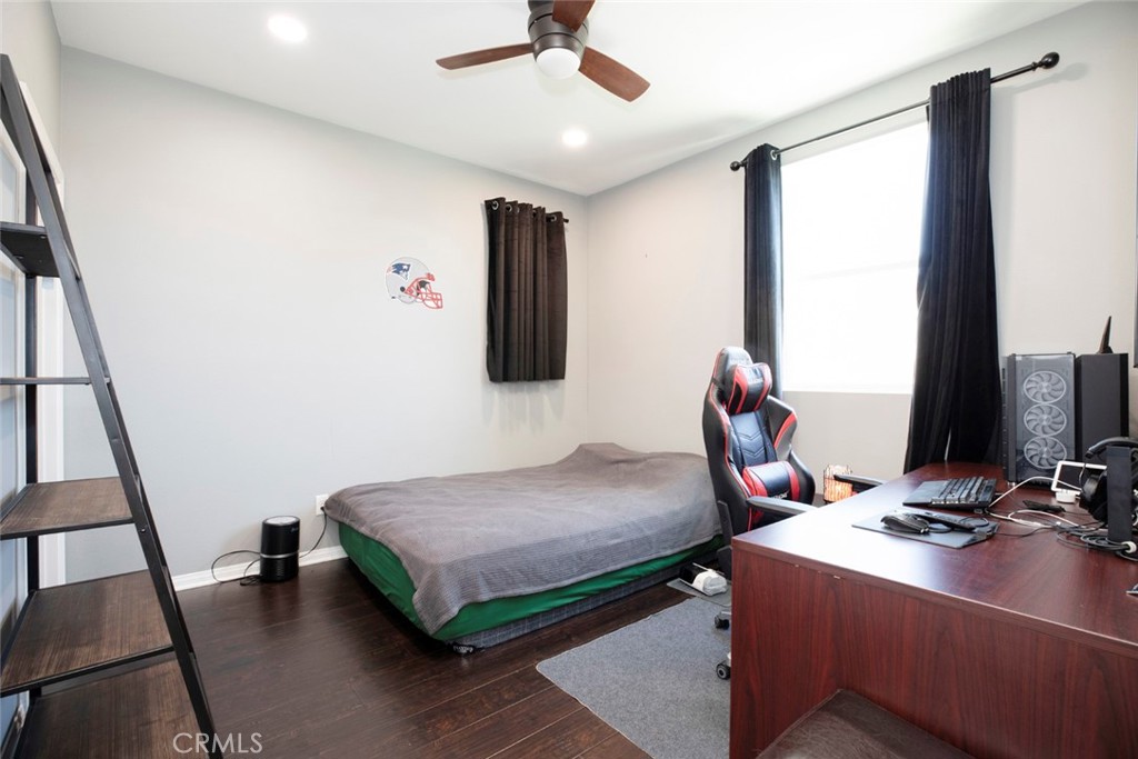 8656 Winnetka Avenue Winnetka, CA 91306 - Photo 15 of 31 a bedroom with furniture and a window